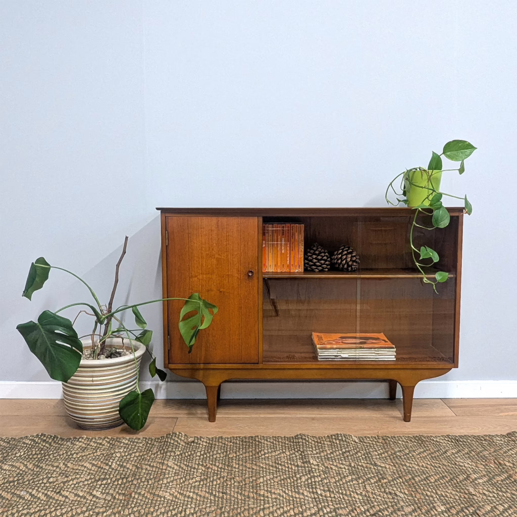 On show and hidden storage in one useful cabinet. Part bookcase / display cabinet, part cupboard, this is a really handy, vintage domestic piece. It dates from the 1960s with a design that's neutral and won't compete with other furniture. Great original condition, it's ready to serve.   