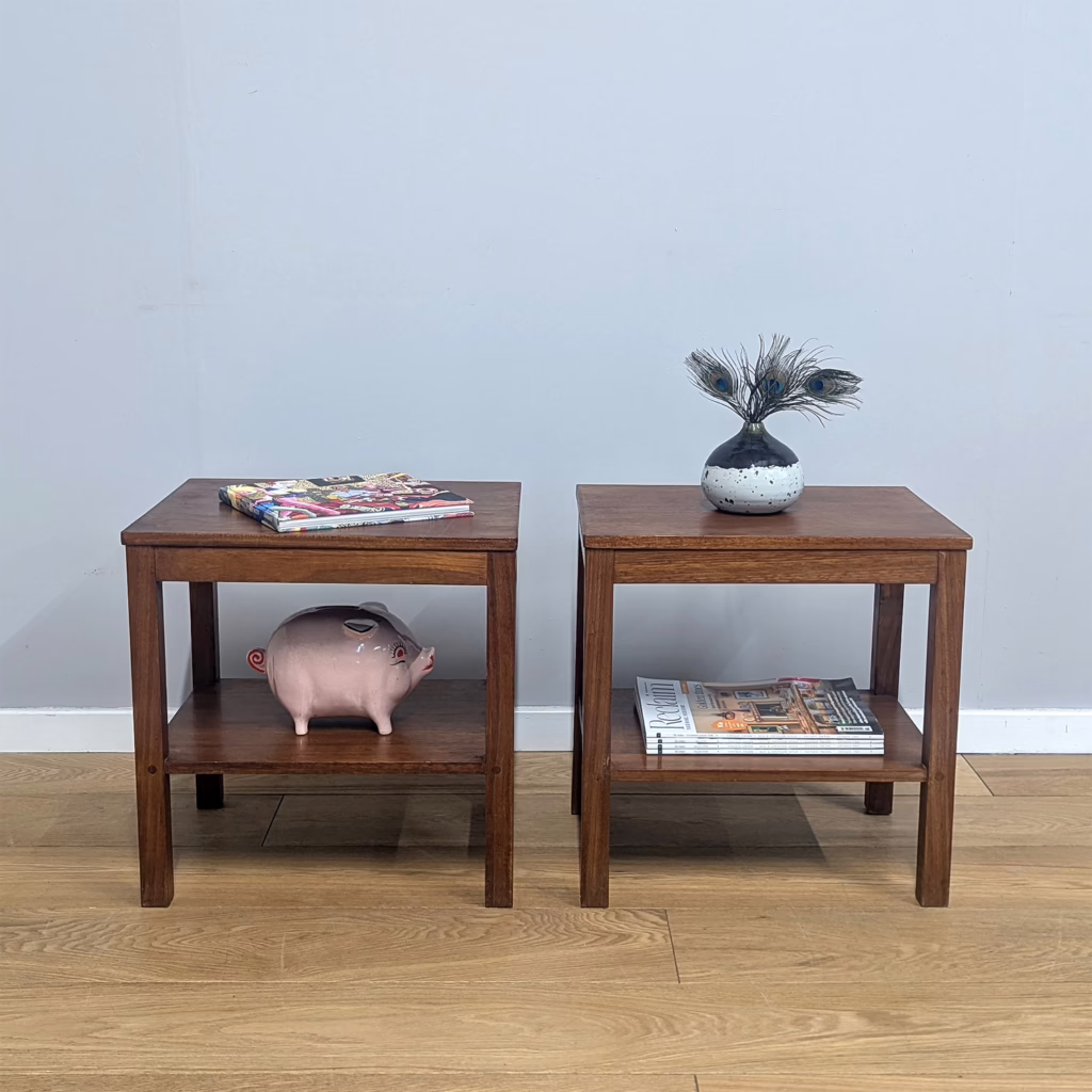 It's not often we source matching vintage nightstands / side tables and we were charmed by this unusual pair. We believe them to be scratch-made, one-off pieces by someone who knew quality wood and joinery. Their design may be simple and plain, rather Brutalist in fact with their chunky legs, but they have been carefully and skilfully crafted with expertise. Perhaps a side project for a cabinet maker? The design is matching but one of the tables is a touch shallower in depth by 2cm, suggesting they were each made for a specific spot. With a lower shelf they could be put to good use in any room as occasional tables or stands. They would also serve very well as nightstands.